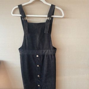 Corduroy dress with gold bottons down the center.